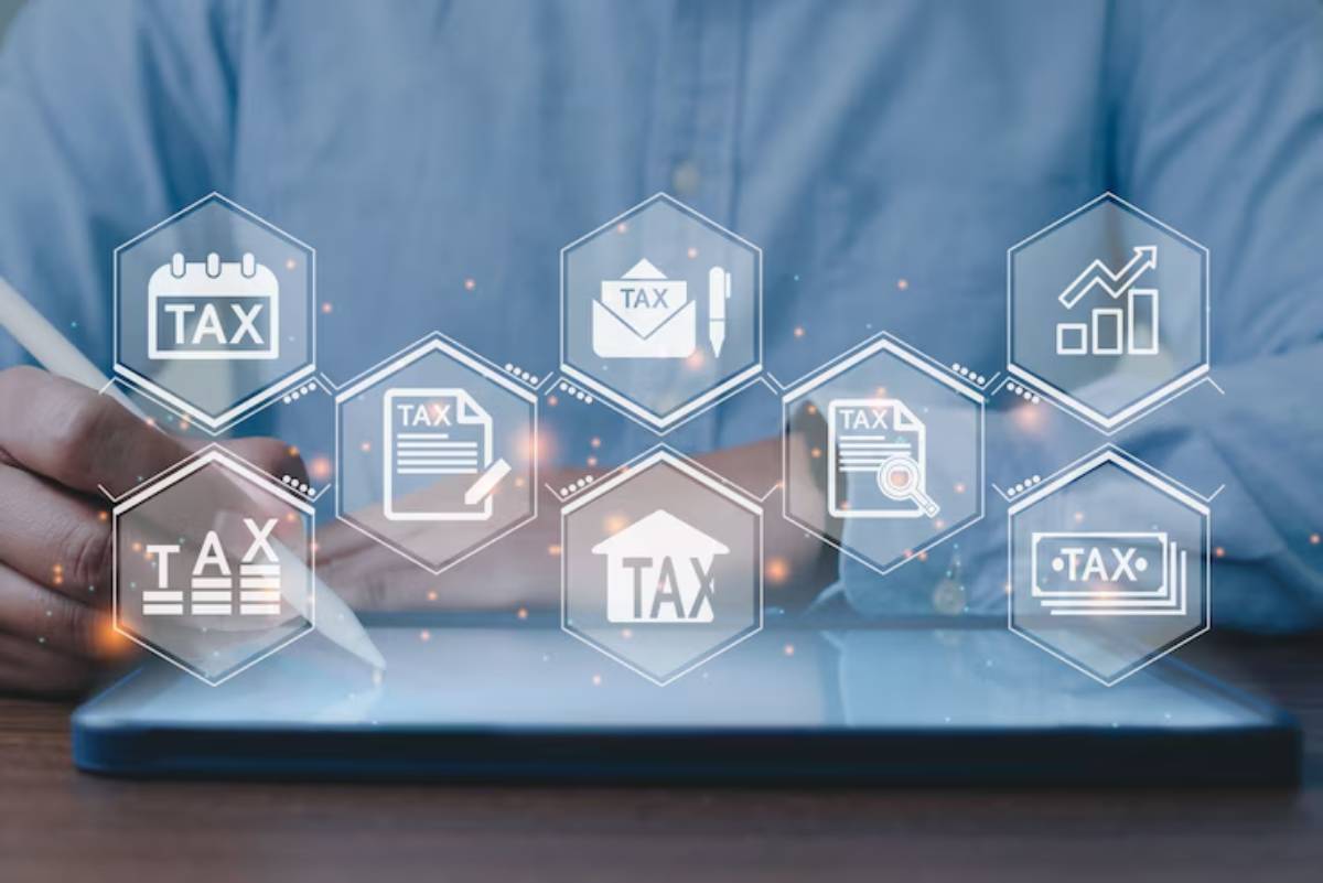 A person uses a tablet to manage taxes, surrounded by digital icons representing various tax-related activities and documents.
